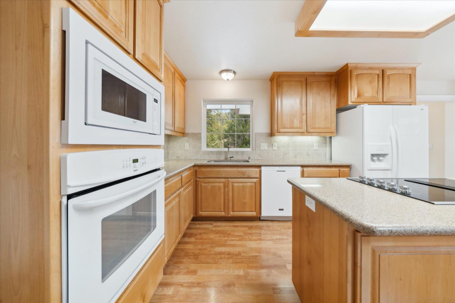 2995 Goose Ranch Road Lewiston, CA 96052 - Photo 12 of 87 a kitchen with stainless steel appliances granite countertop a kitchen island a stove a sink and a microwave