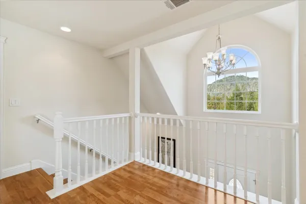 a view of outdoor space with wooden floor and windows