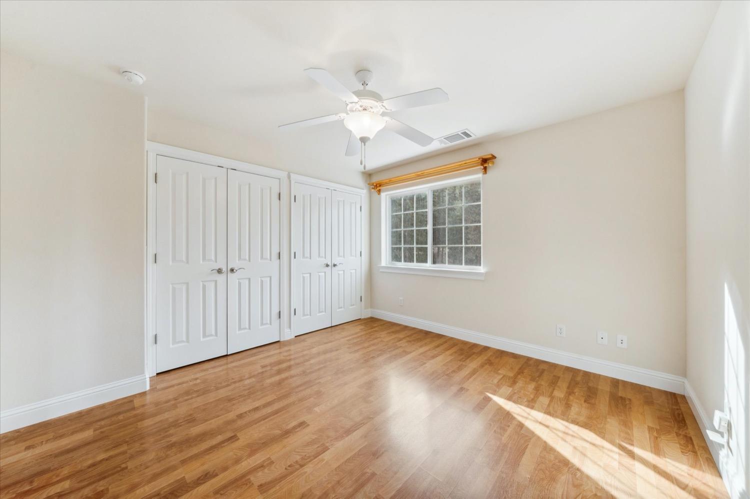 2995 Goose Ranch Road Lewiston, CA 96052 - Photo 24 of 87 a view of empty room with wooden floor and fan