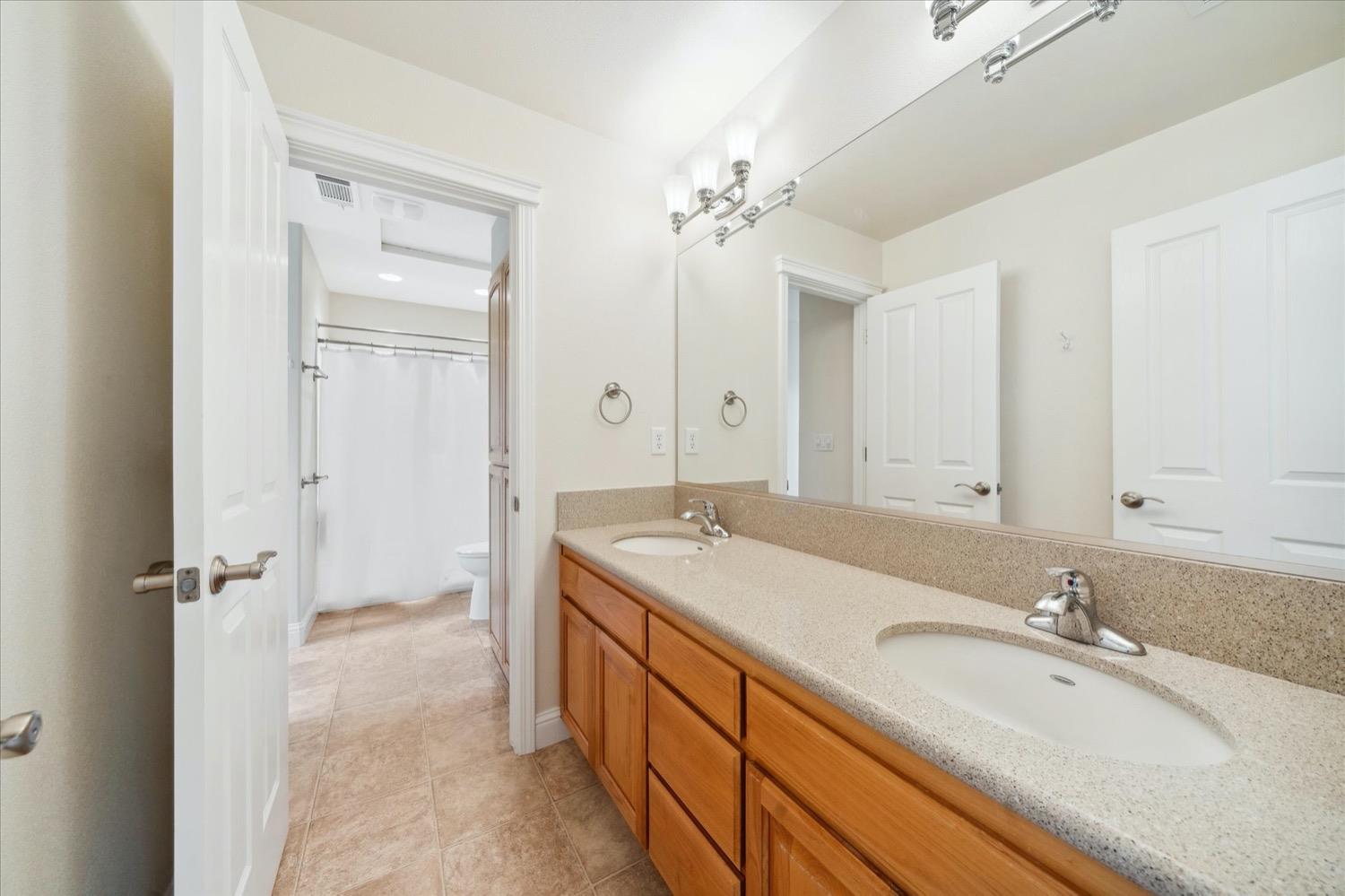 2995 Goose Ranch Road Lewiston, CA 96052 - Photo 28 of 87 a bathroom with a sink double vanity granite tub shower and a mirror