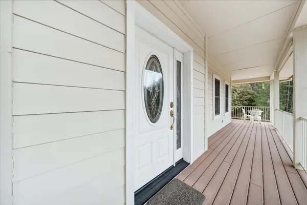 a view of an empty room and wooden floor
