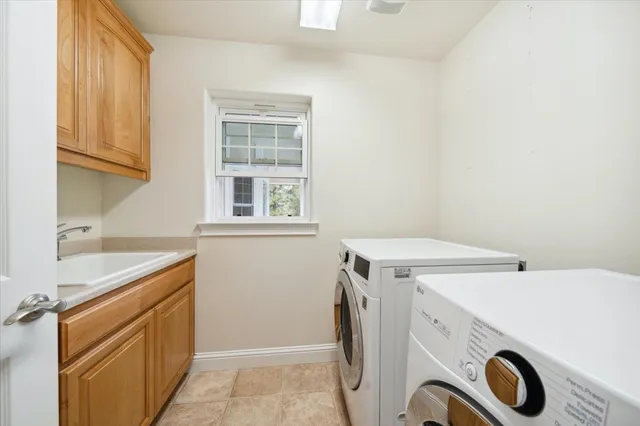 a view of a lush green field with mountains in the background