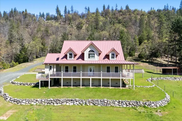 a view of a large window with a garden and yard