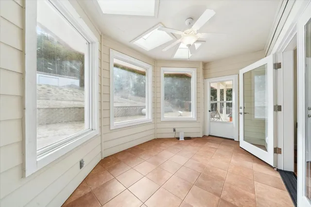 a view of a kitchen with a sink and wooden floor