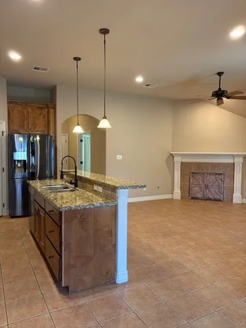 a kitchen with a stove and a sink