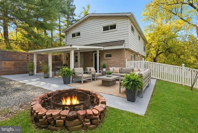 a view of a backyard with plants and patio