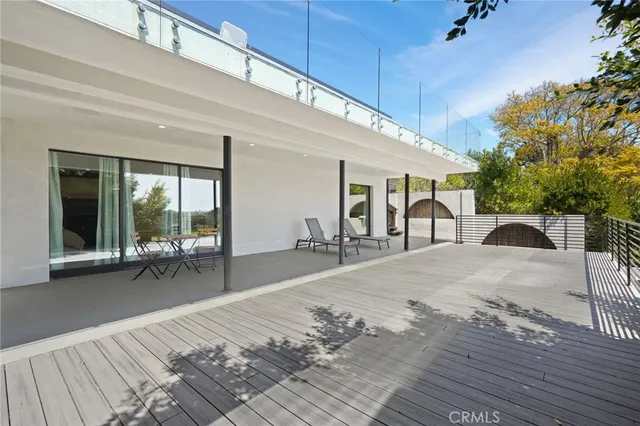 a swimming pool with outdoor seating and yard
