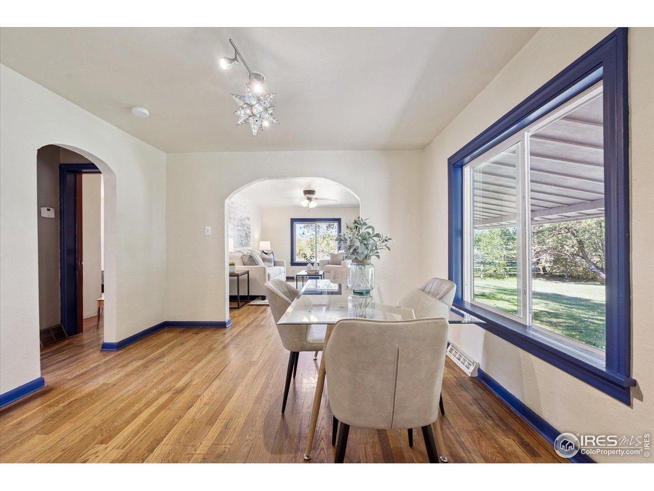 1351 Marshall Road Boulder, CO 80305 - Photo 12 of 46 a view of a dining room with furniture window and wooden floor