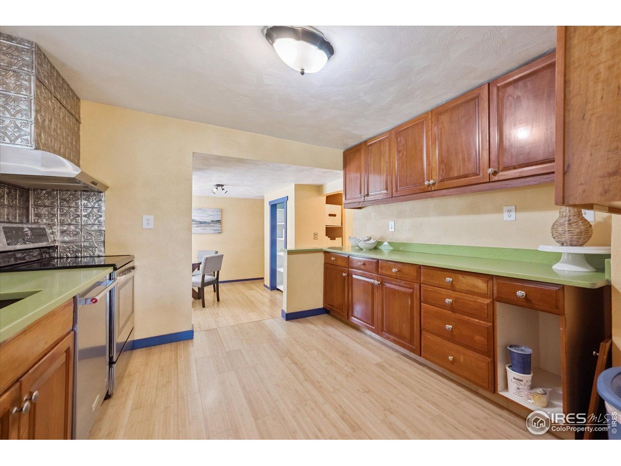 1351 Marshall Road Boulder, CO 80305 - Photo 13 of 46 a kitchen with stainless steel appliances granite countertop wooden cabinets a stove a sink and dishwasher