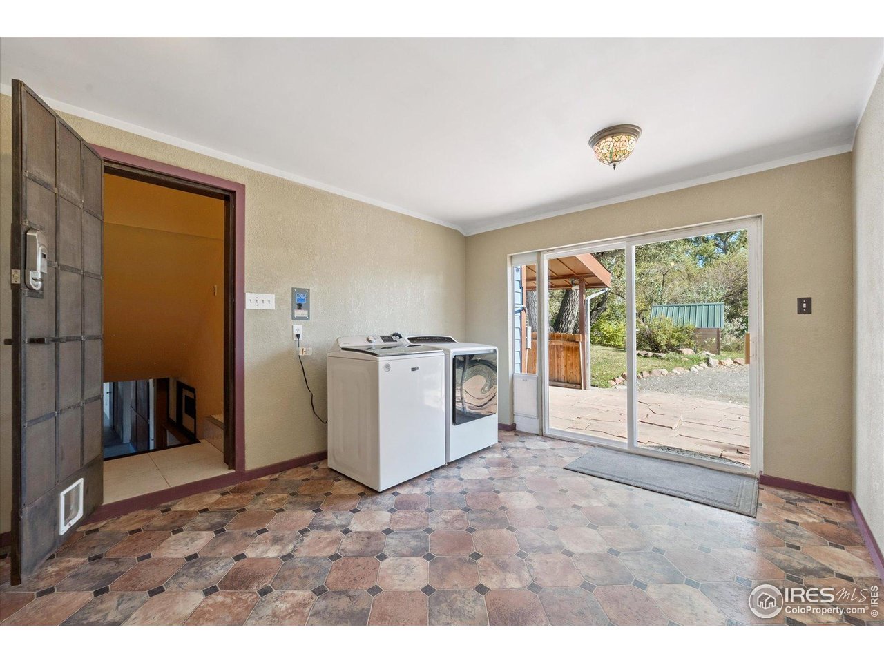 1351 Marshall Road Boulder, CO 80305 - Photo 25 of 46 a view of a kitchen with refrigerator and windows