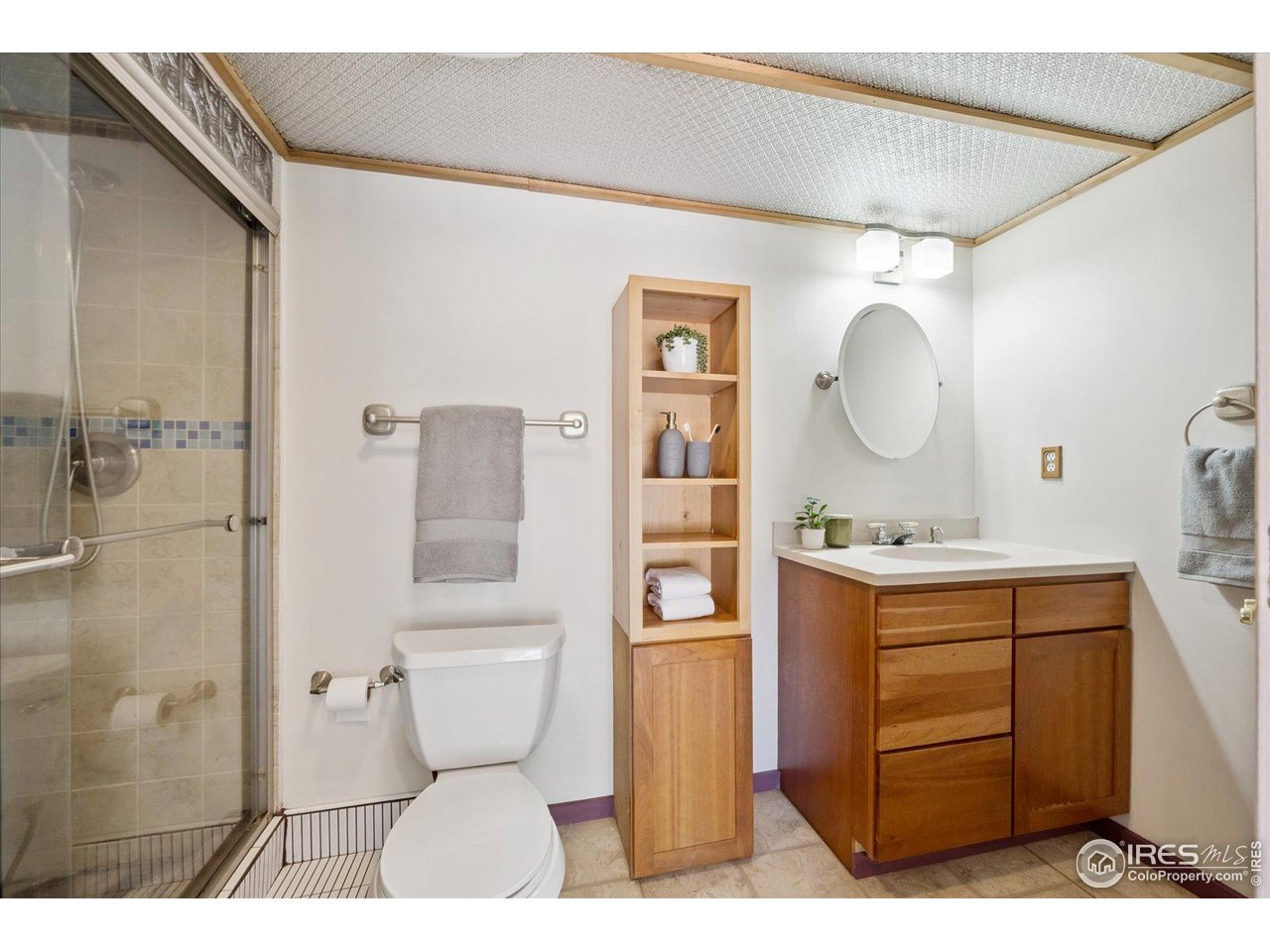 1351 Marshall Road Boulder, CO 80305 - Photo 26 of 46 a bathroom with a toilet a sink and a mirror