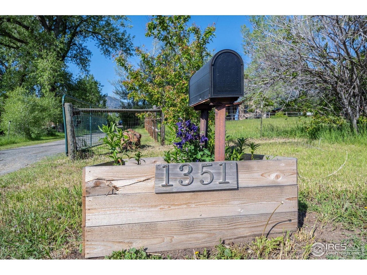 1351 Marshall Road Boulder, CO 80305 - Photo 39 of 46 a wooden bench sitting in front of a house
