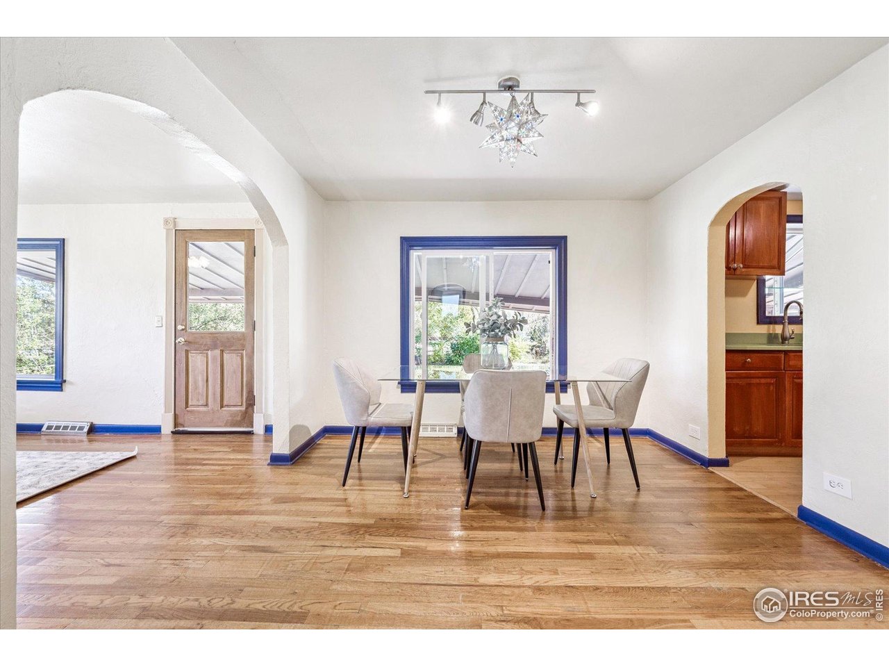 1351 Marshall Road Boulder, CO 80305 - Photo 9 of 46 a view of a dining room with furniture window and wooden floor