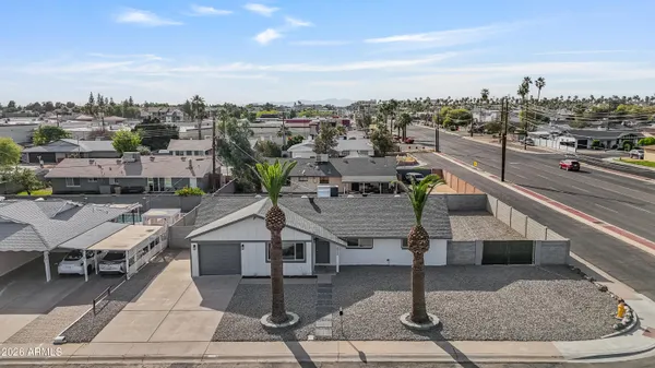 an aerial view of residential houses with outdoor space