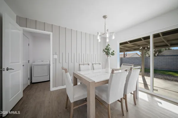 a open kitchen with white cabinets and stainless steel appliances