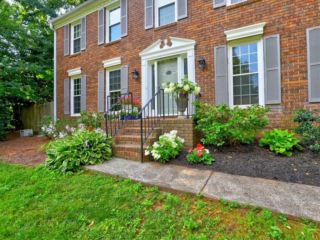 4512 Woodlawn Lake Drive Marietta, GA 30068 - Photo 1 of 55 front view of a house with a yard