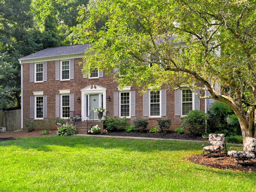 4512 Woodlawn Lake Drive Marietta, GA 30068 - Photo 11 of 55 a front view of a house with garden