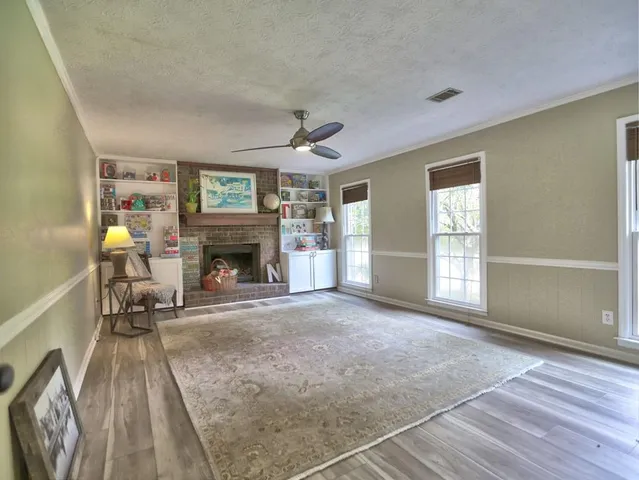 a living room with furniture and a rug