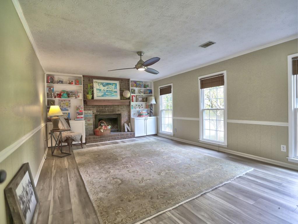 4512 Woodlawn Lake Drive Marietta, GA 30068 - Photo 16 of 55 a living room with furniture and a fireplace