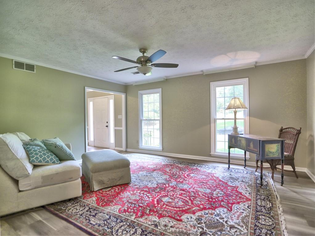4512 Woodlawn Lake Drive Marietta, GA 30068 - Photo 17 of 55 a living room with furniture and a window