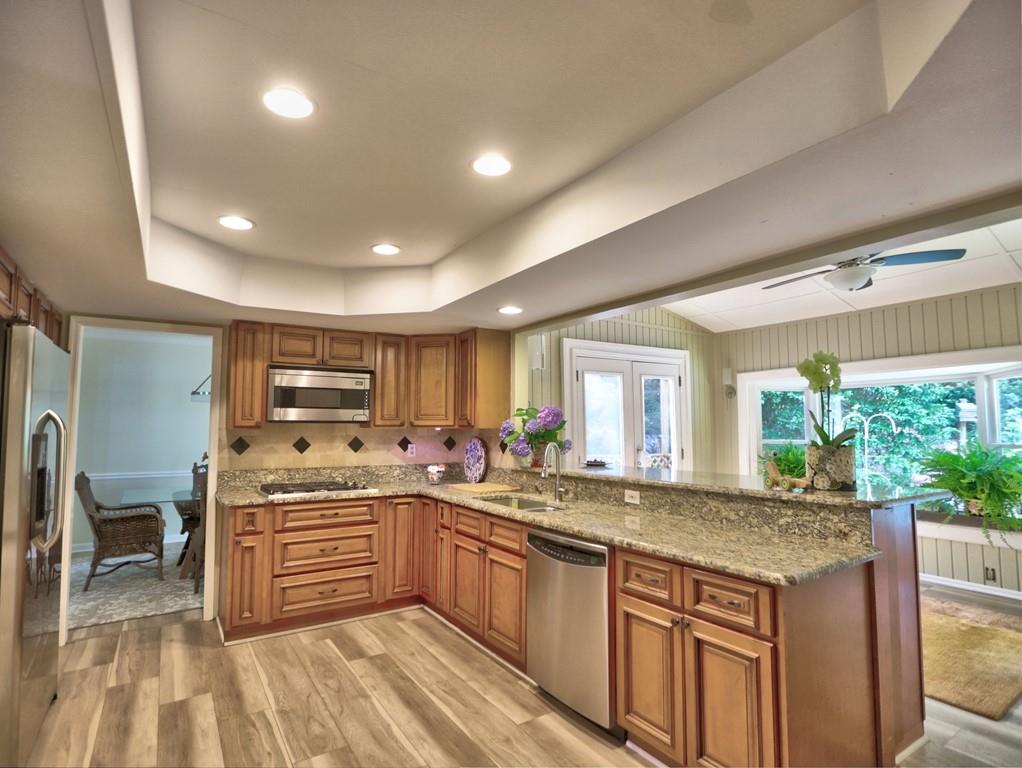 4512 Woodlawn Lake Drive Marietta, GA 30068 - Photo 23 of 55 a kitchen with stainless steel appliances granite countertop a stove and a sink