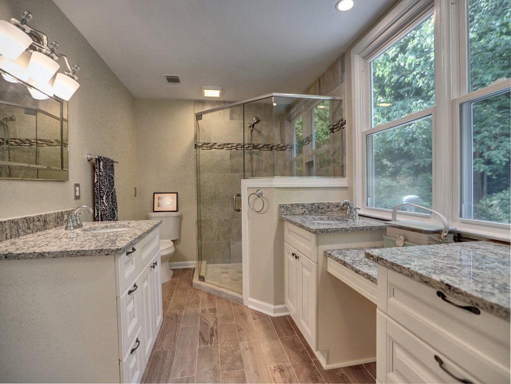 4512 Woodlawn Lake Drive Marietta, GA 30068 - Photo 31 of 55 a open kitchen with granite countertop a sink stove and refrigerator