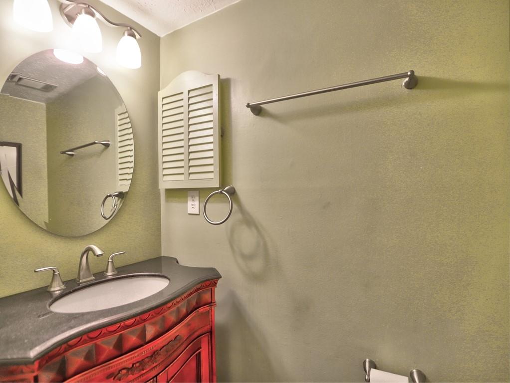 4512 Woodlawn Lake Drive Marietta, GA 30068 - Photo 37 of 55 a bathroom with a sink and a mirror