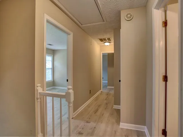 a view of swimming pool from a lounge chair