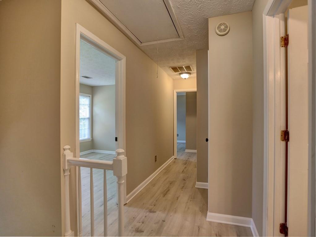 4512 Woodlawn Lake Drive Marietta, GA 30068 - Photo 38 of 55 a view of a bathroom from a hallway