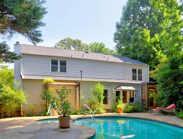a view of a swimming pool with a patio