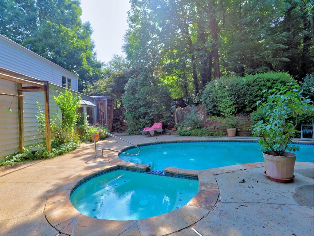 4512 Woodlawn Lake Drive Marietta, GA 30068 - Photo 41 of 55 a view of swimming pool from a lounge chair