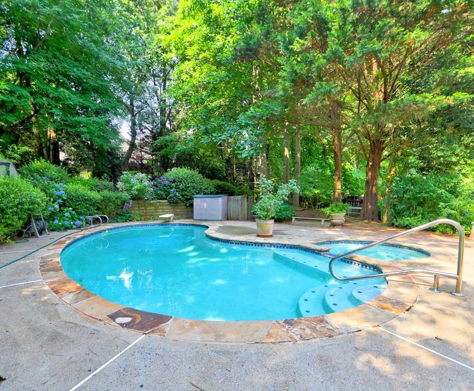 4512 Woodlawn Lake Drive Marietta, GA 30068 - Photo 42 of 55 a view of a swimming pool with a patio