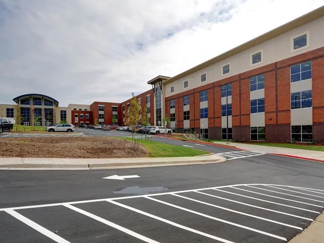 a view of a swimming pool with a patio