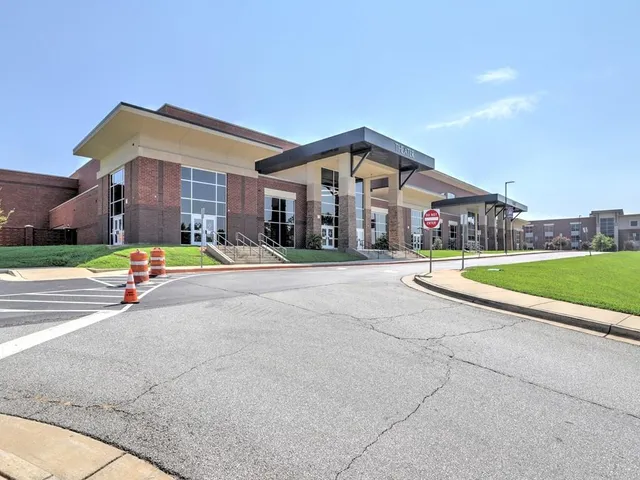a view of a backyard with swimming pool