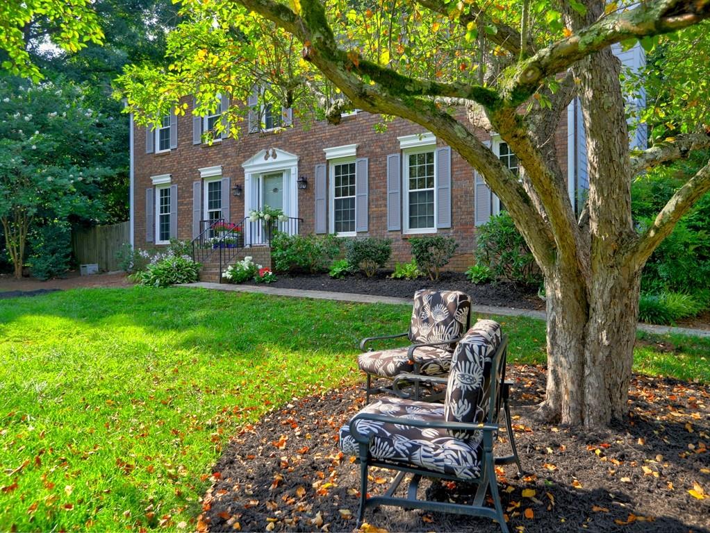 4512 Woodlawn Lake Drive Marietta, GA 30068 - Photo 7 of 55 a view of a house with backyard sitting area and garden