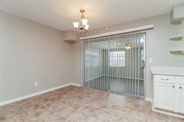 a view of a glass door and a window in a room