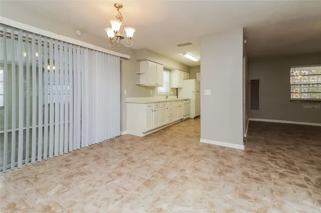 a bathroom with a granite countertop sink a toilet and a bathtub