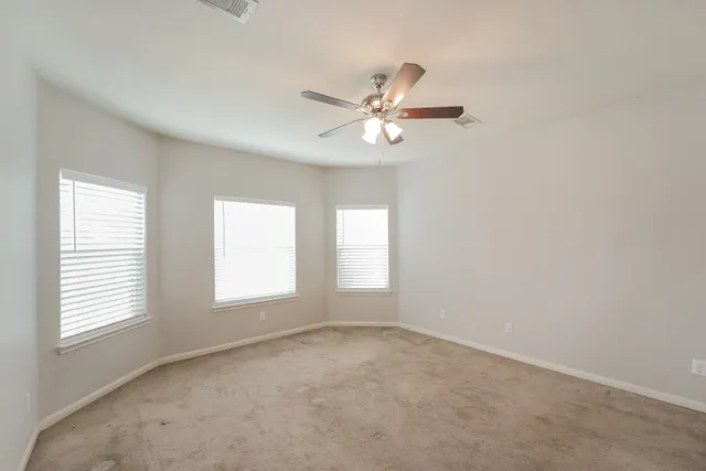 a view of empty room with windows