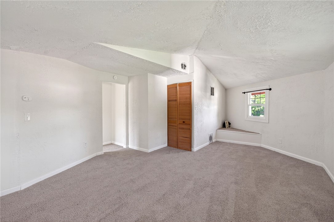 2684 Arthur Road Springfield, OH 45502 - Photo 10 of 69 This versatile room offers plush carpeting and ample natural light, ideal for a variety of uses.