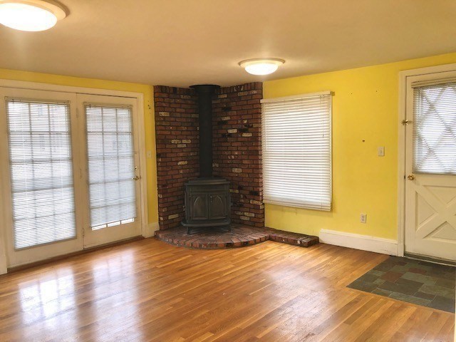 10 Summer Street Saugus, MA 01906 - Photo 14 of 42 wooden floor in an empty room with a window