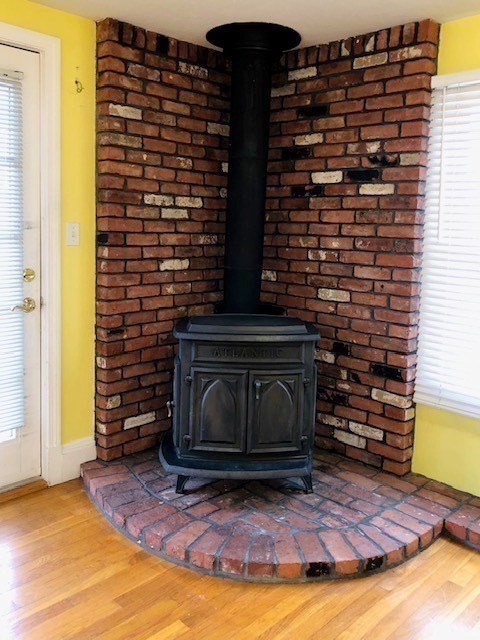 10 Summer Street Saugus, MA 01906 - Photo 15 of 42 a view of fireplace and wooden floor