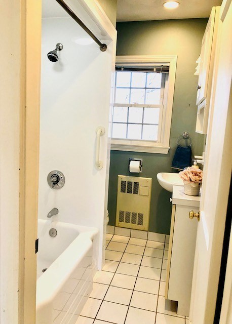 10 Summer Street Saugus, MA 01906 - Photo 25 of 42 a bathroom with a bathtub and a shower