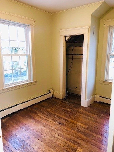 10 Summer Street Saugus, MA 01906 - Photo 27 of 42 an empty room with wooden floor and windows