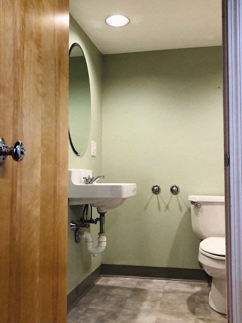 10 Summer Street Saugus, MA 01906 - Photo 32 of 42 a bathroom with a sink a toilet and a mirror