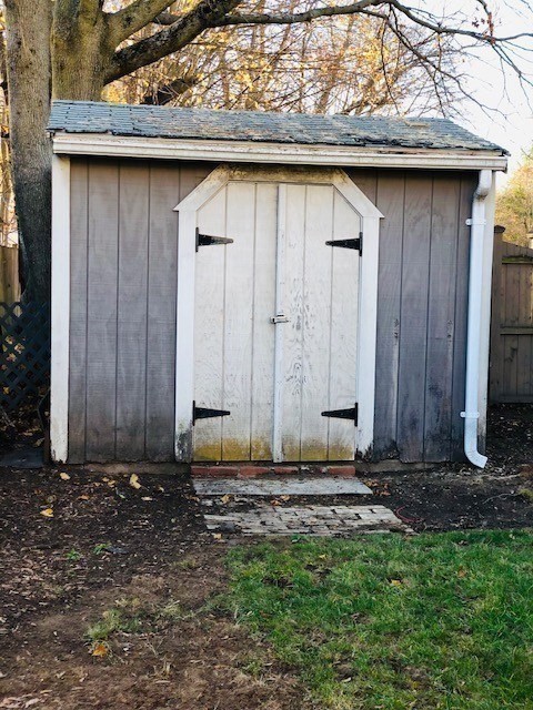 10 Summer Street Saugus, MA 01906 - Photo 40 of 42 a wooden door in the backyard of a house