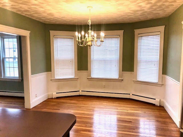 10 Summer Street Saugus, MA 01906 - Photo 10 of 42 an empty room with wooden floor and windows