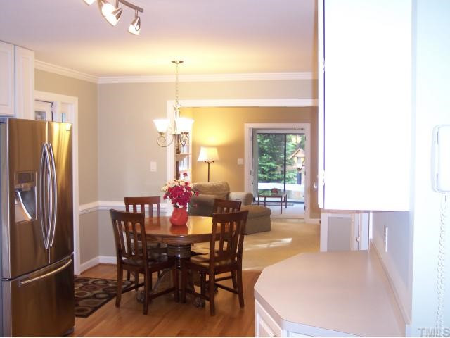 11805 Old Creedmoor Road Raleigh, NC 27613 - Photo 4 of 12 View of the Kitchen Looking Toward the Family Room & Distant Sun Room. The Eat-in-Kitchen Area Enjoys Views of the Deck and Yard! The New Samsung 28.5' cu ft Refrigerator/Freezer with Ice/Water Dispenser & Info Center will Convey with the Purchase! Breakfast Area
