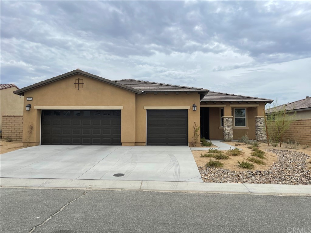 a front view of a house with yard