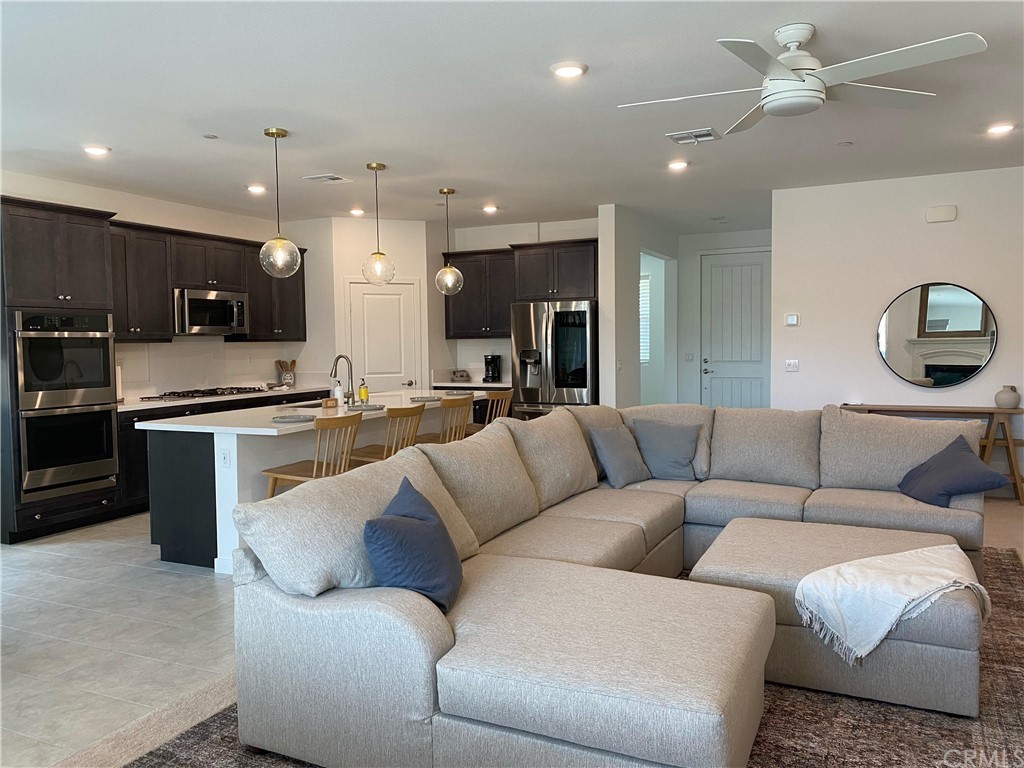 40274 Vivaldi Court Indio, CA 92203 - Photo 22 of 23 a living room with furniture kitchen view and a chandelier