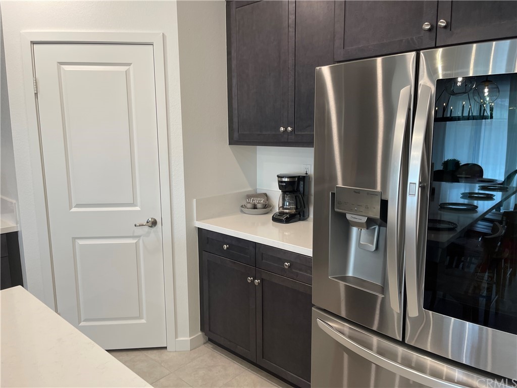 40274 Vivaldi Court Indio, CA 92203 - Photo 3 of 23 a kitchen with a refrigerator and cabinets